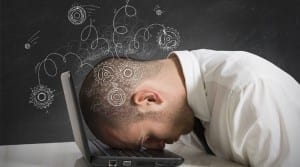 Failure man with his head down on the laptop
