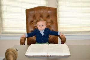 A kid on a office desk